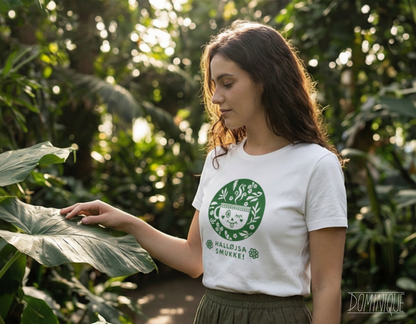 Woman wearing a white t-shirt with a green logo in a forest setting